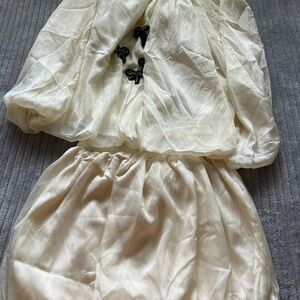 Elegant Cream Dress with Black Embellishments